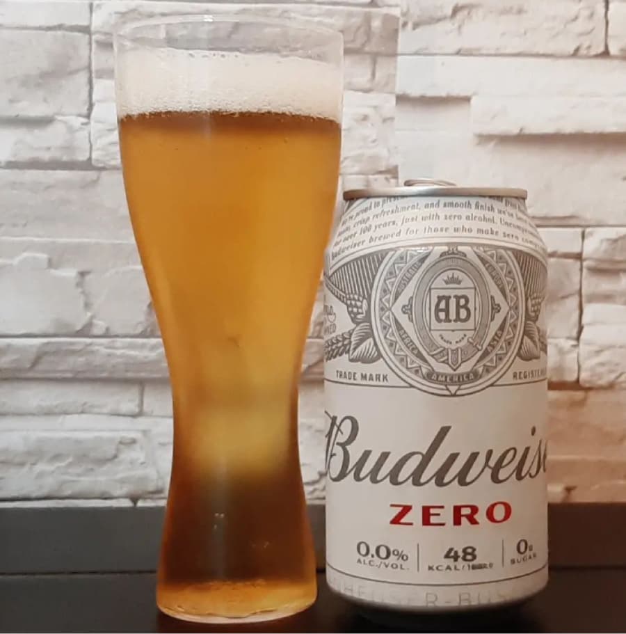 budweiser zero can with a 500ml glass full of budweiser zero